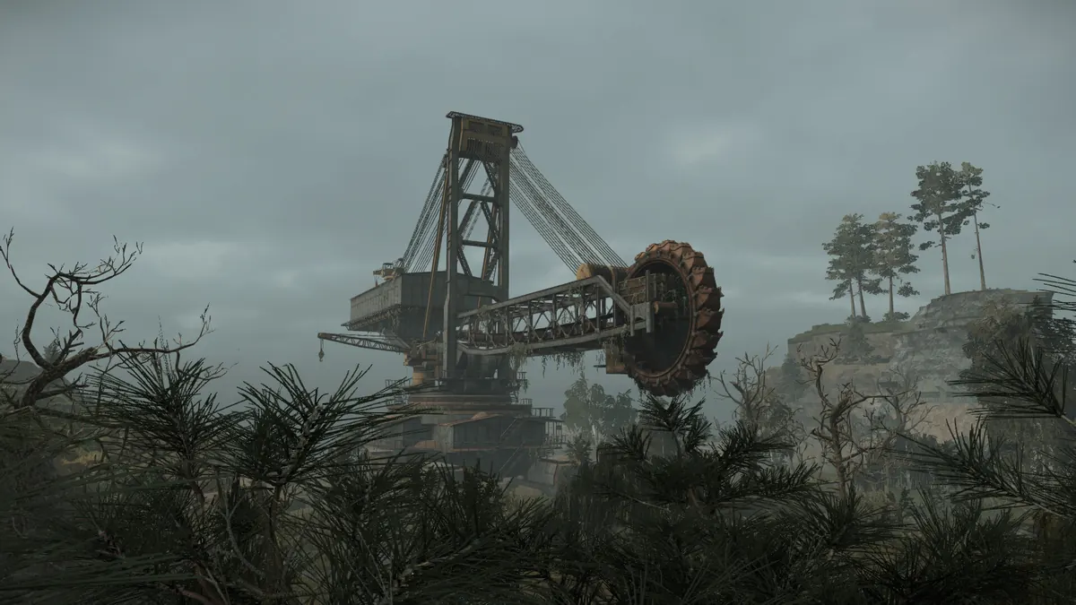 Giant rusted excavator looming over the STALZONE wasteland